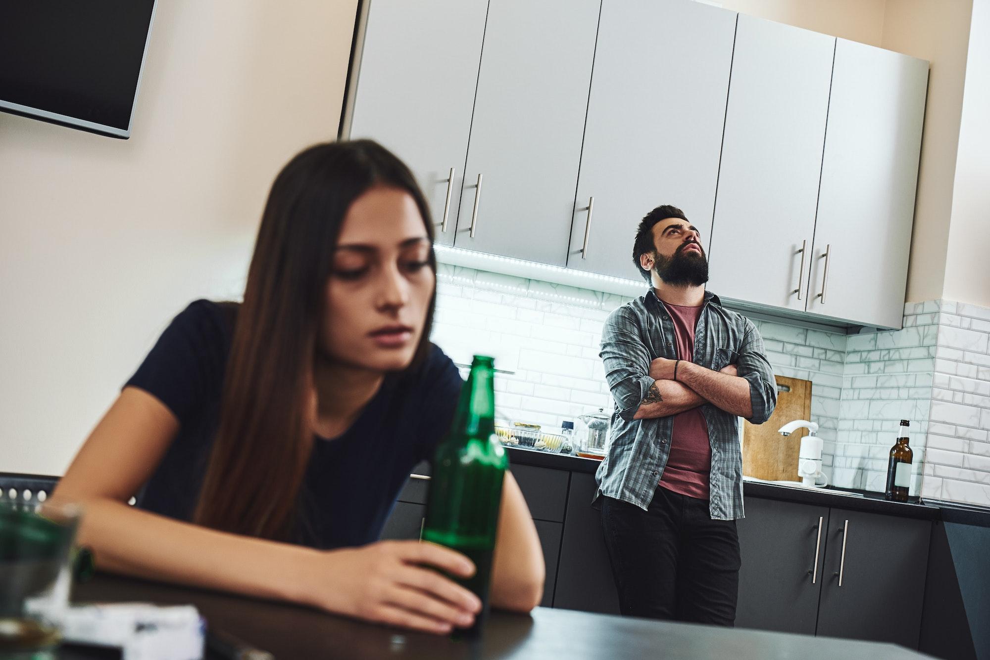 A woman drinking at home, much to her husband's dismay. She needs residential treatment at Saving My Tomorrow